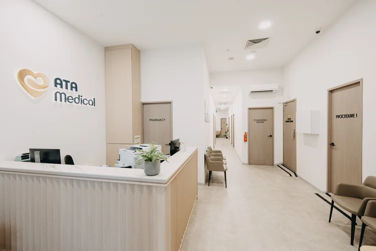 ATA Medical Tanjong Pagar Clinic reception area with counter and consultation rooms along the hallway.