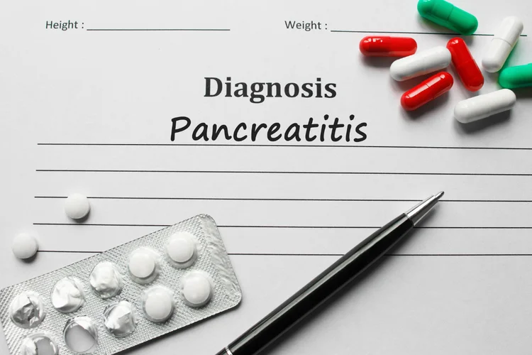 Diagnosis form showing pancreatitis with tablets and pen linked to tirzepatide side effect risks.