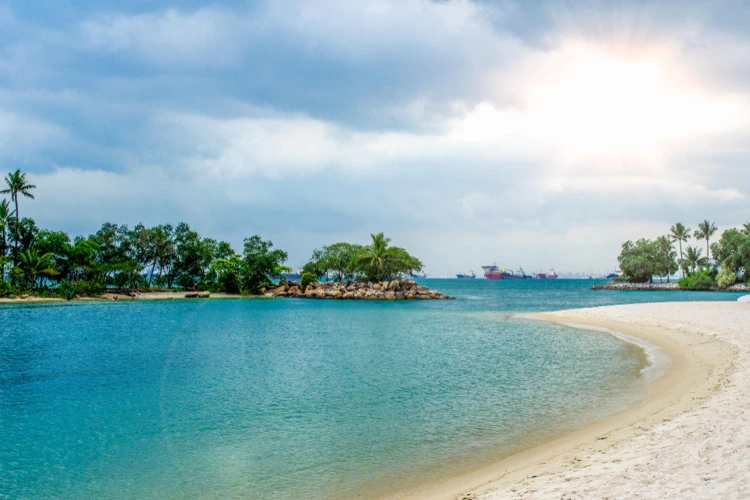 Clear and sunny weather forecasted during the day at Sentosa Beach in Singapore.