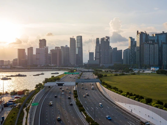 Major expressway in Singapore with the city skyline in the background.